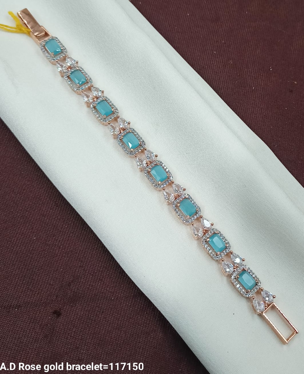 Rose Gold Bracelet with Sky Blue Emerald-Cut Stones – AD Design